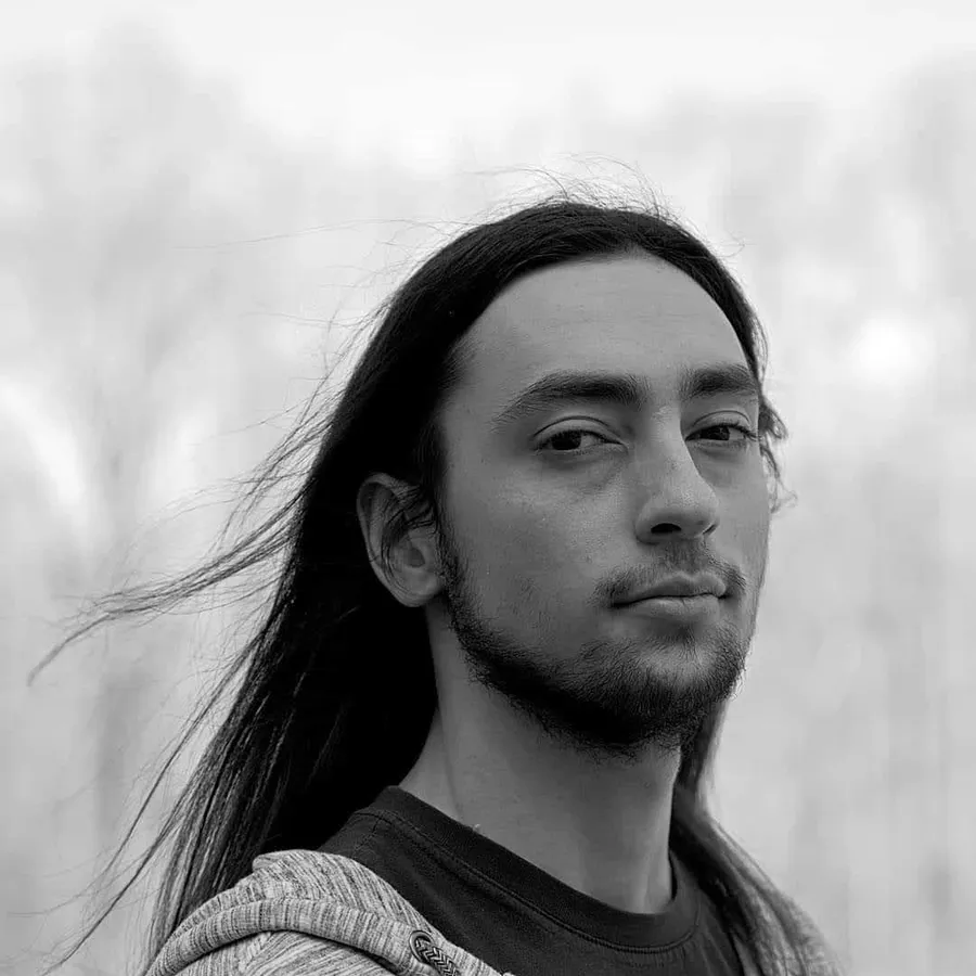 Black-and-white portrait of Alisson David Frangullys.